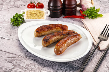 Delicous natural roasted sausages in the plate
