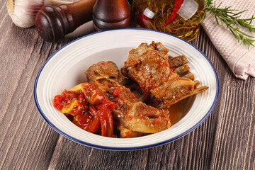 Baked lamb ribs with vegetables