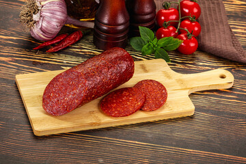 Spicy pepperoni sausages with sliced piece