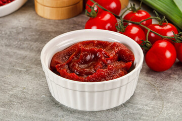 Red tomato paste in the bowl