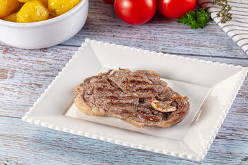 Grilled lamb steak with bone
