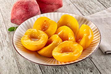 Sweet ripe yellow canned peaches
