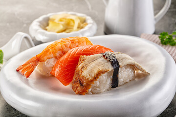 Japanese cuisine - sushi with eel, salmon and prawn