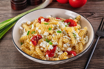 Italian pasta fusili with curd