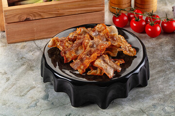 Fried crispy pork bacon snack