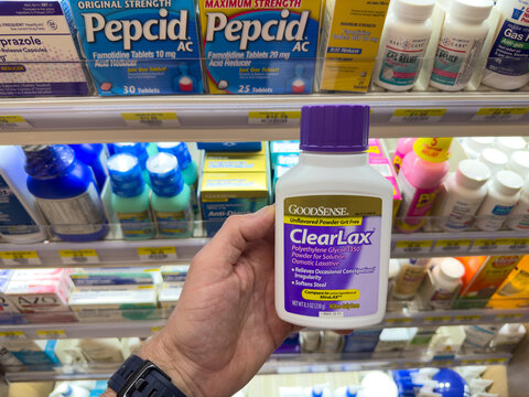 ClearLax Powder Laxative Bottle Held in Pharmacy Aisle

