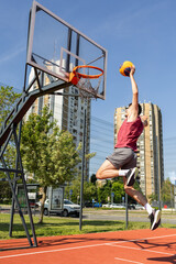Sportmen playing game of basketball at outdoor court © Dusan Kostic
