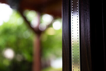 Obraz premium Double glazed thermopan glass in wood window, focus on the aluminum bar, space for text.