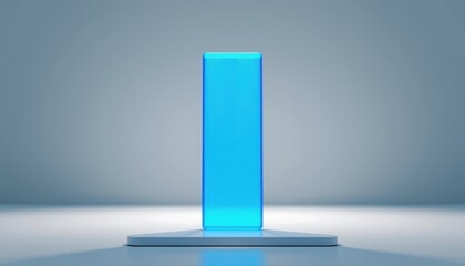 Minimalist blue rectangular glass pillar standing on a white platform with a soft gradient background.