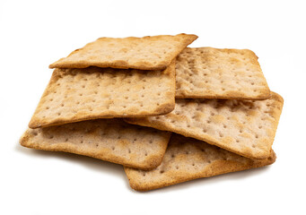 Stack of square whole wheat cracker isolated on white background – close-up of healthy baked...