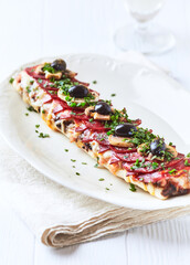 Open-faced toasted cheese sandwich on white background. Close up	