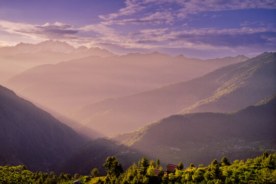 Sunrise in the mountains.  At 6,900 feet,  serene meadows, pine forests, and proximity to the Great Himalayan National Park, Sainj Valley of Kullu District, Himachal Pradesh, India.
