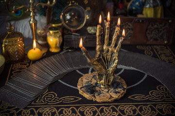 Candle burns on the altar, magic among candles, clean negative energy, wicca concept	 