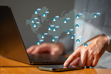 The  Business man use smartphone to connect icon of people networking around the world.