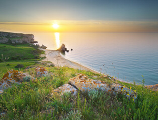 Sunset on cliffs. Beautiful spring nature and sea landscape.