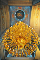 An Orthodox Christ church with massive chandelier.