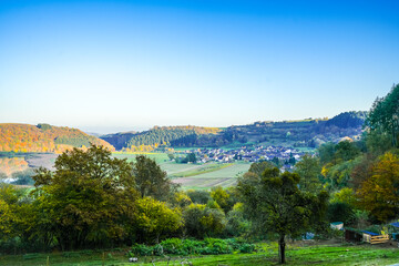View of the landscape at the Meerfelder Maar. Nature at the crater lake in the Volcanic Eifel National Park. The surrounding area near Meerfeld at sunset in the evening.
