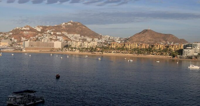 Cabo San Lucas Mexico city from ship morning. Resort city at southern tip of the Baja California peninsula. Beach malecon markets. Eco tourism is source of tourism income. Commercial seaport. 