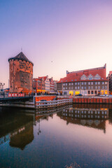 Naklejka premium Gdansk with Motlawa river in Poland. Old town colourful house with The Stągiewny drawbridge