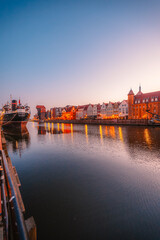 Gdansk with Motlawa river in Poland. Old town colourful house with Stragania Gate