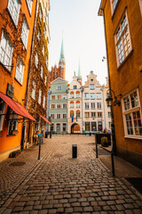 Obraz premium Gdansk with Motlawa river in Poland. Old town colourful house with saint Marys church i main square..