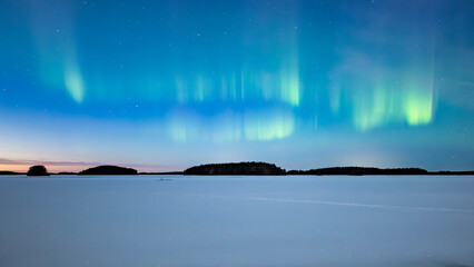 Northern lights dancing over lake in Farnebofjarden national park in north of Sweden