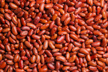 Pile of red kidney beans. Red kidney beans texture. Flat lay. Top view