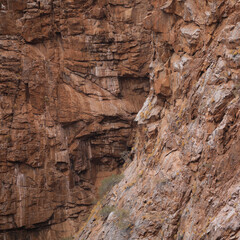 Lines and textures in rocks of mountain cliff