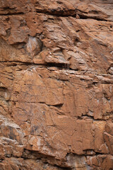 Lines and textures in rocks of mountain cliff