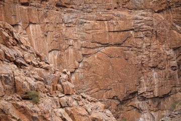 Lines and textures in rocks of mountain cliff