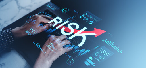 Businessman analyzing forex risk chart on digital interface with data graphics.