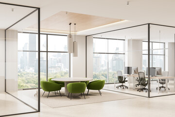 Modern office interior with round meeting table and green chairs in glass-walled space overlooking city skyline on a bright day. 3D Rendering © ImageFlow