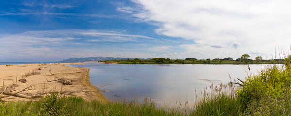 Panoramic view of Gola del Ter, Costa Brava, Spain, with the extensive beach, dunes and the Mediterranean Sea next to the mouth of the Ter River.