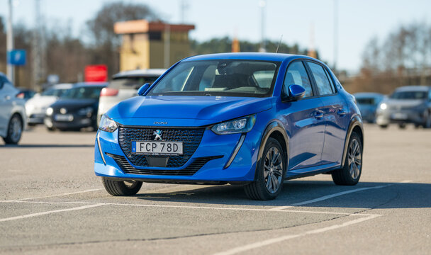 Gothenburg, Sweden - April 06 2025: Blue 2021 Peugeot 208 car parked in daylight parking lot.