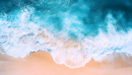 Obraz premium Ocean waves on the beach as a background. Beautiful natural summer vacation holidays background. Aerial top down view of beach and sea with blue water waves