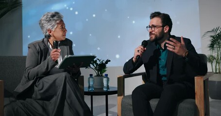 Tablet, speaker or people with mic in interview for global economy, forum or finance resources. Answer, questions and guest with speech in show or stage for financial growth, solution or convention