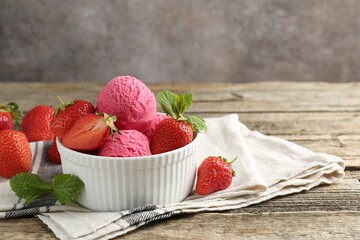 Tasty sorbet with strawberries and mint served on wooden table, closeup. Space for text