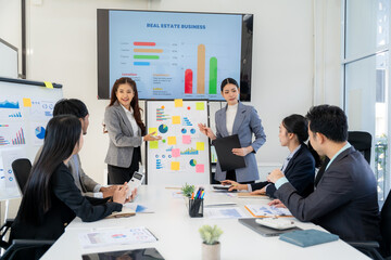 Business Team Presentation in Meeting Room