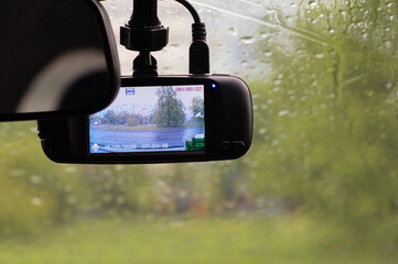 Transport safety. Video recorder installed on car glass