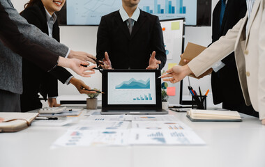 Business Team Analyzing Data at Meeting