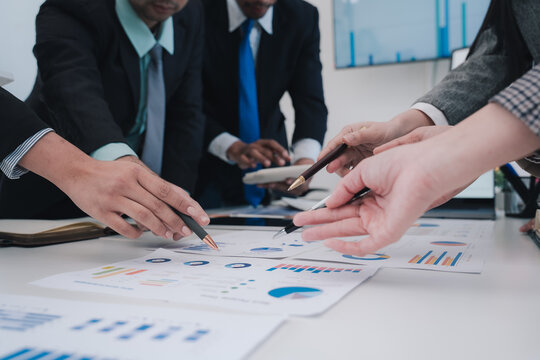 Business Team Analyzing Financial Data - Powered by Adobe