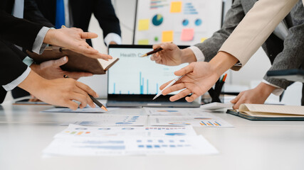 Business Team Analyzing Data and Charts