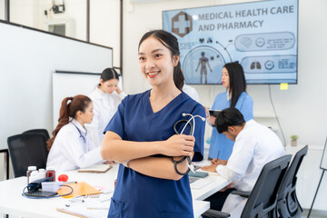 Obraz premium Confident Asian Female Doctor with Medical Team