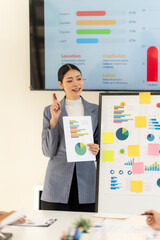 Fototapeta premium Businesswoman Presenting Data Charts