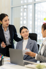 Asian Businesswomen Collaborating in Office