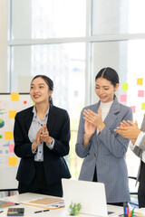 Businesswomen Applauding Success in Office