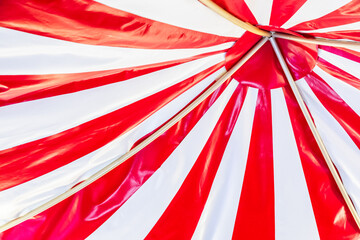 Circus tent background. Colorful design, striped white and red, retro style.