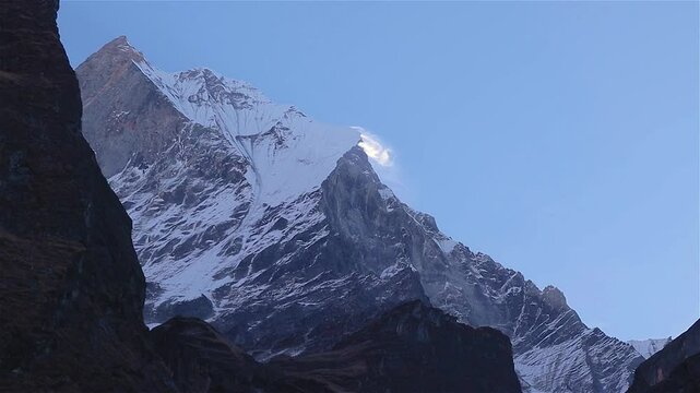 Mt. Fishtail or Machhapuchhare mountain, part of Nepal himalaya in close up. Snow blowing in the wind.