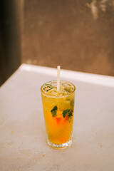 Refreshing citrus drink garnished with mint leaves on a warm afternoon