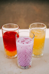 Colorful refreshing drinks served in beautiful glasses at a summer gathering